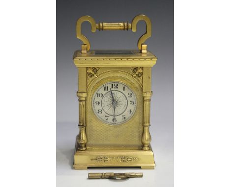 A late 19th century French lacquered brass carriage clock with eight day movement striking hours and half hours on a gong, th