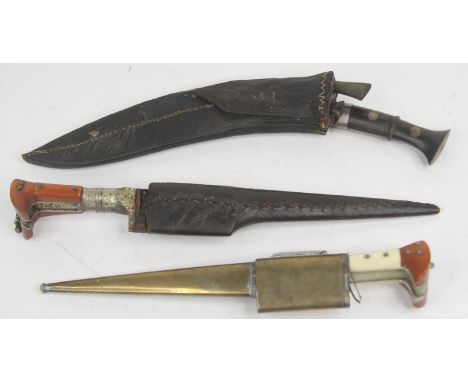 A vintage kukri with leather sheath, together with two Afghan Khyber knives (3)