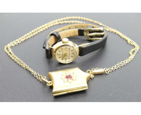 A 9ct gold finelink neck chain, with gilt metal and paste set pendant; together with a lady's 9ct gold cased manual wind wris