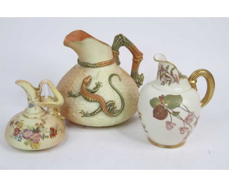 A Royal Worcester blush ivory jug, No. 1714, decorated with a lizard, h.16cm; together with two further Royal Worcester jugs 