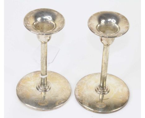 A pair of Elizabeth II weighted silver candlesticks, of plain circular form, maker LJ Millington, Birmingham 2008, h.13cmEach