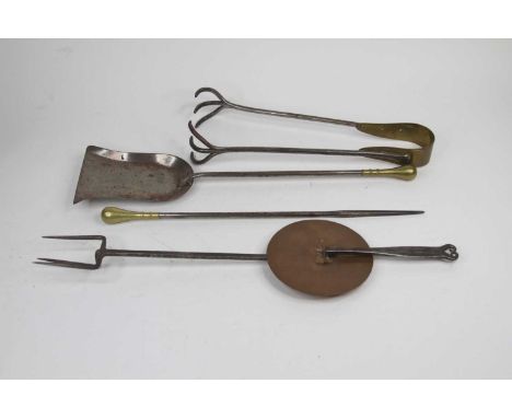 A collection of antique fire tools