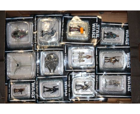 A tray containing Star Wars figures to include Millennium Falcon, Tie Fighter pilot, etc