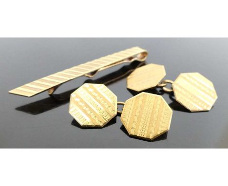 A pair of gent's 9ct gold engine turned octagonal cufflinks, 14mm; together with a 9ct gold and engine turned tie-clip, 5cm, 