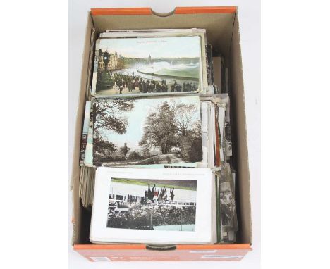 A collection of vintage postcards to include portrait and topographical examples