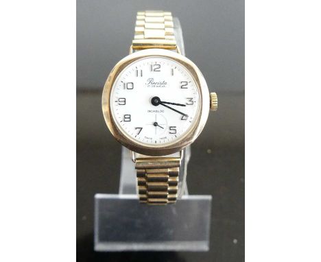 A Precista lady's 9ct gold cased vintage manual wind wristwatch, on gilt metal bracelet, case dia. 26mm