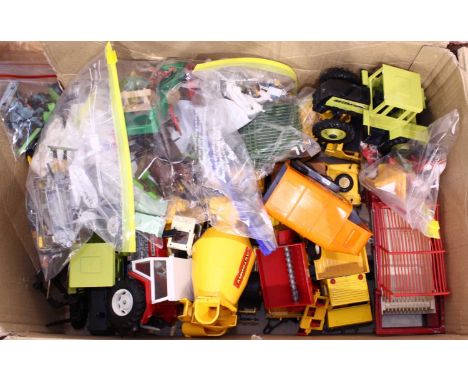 A box containing Britains related vehicles, figures and accessories, to include 1982 Mercedes Benz tractor, and others