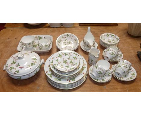 A Wedgwood tea &amp; dinner service in the Wild Strawberry pattern R4406 having printed marks verso, to include dinner plates