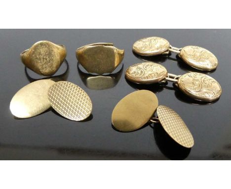 A modern pair of gent's 9ct gold engine turned cufflinks; together with an earlier pair having scroll leaf engraved decoratio
