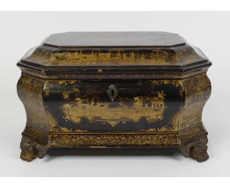 A 19th century Chinese gilt and black lacquer twin compartment tea caddy, of ogee shape, standing upon carved dragon feet, wi