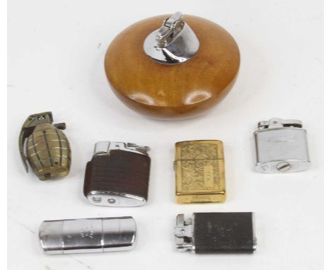 A collection of vintage pocket and table lighters