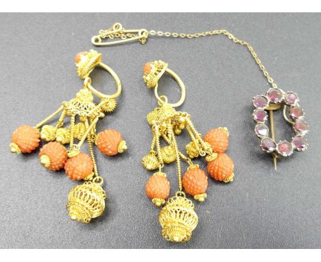 A pair of vintage gilt metal and carved coral pendants, length 5cm; together with a Victorian yellow metal and garnet set bro