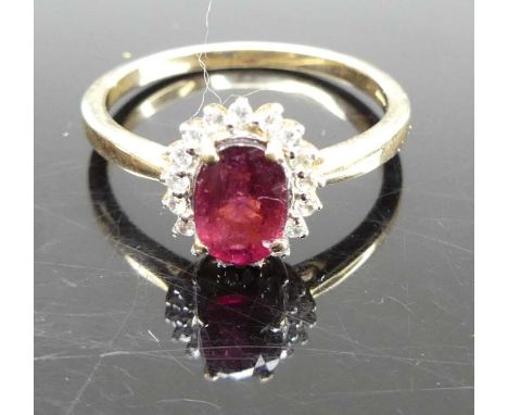 A 9ct gold, garnet and cz set cluster ring, 2.2g, size N