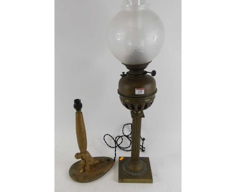 A Victorian brass oil lamp, having an acid etched globe shade, h.76cm; together with a figural giltwood table lamp 