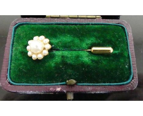 A gilt metal and faux pearl set tie-pin, in fitted leather case, early 20th century 