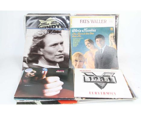 A collection of vintage LPs, to include The Secret Policeman's Ball and David Essex 