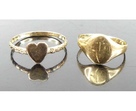 A yellow metal band ring, with heart shaped tablet, unmarked but tests as approx 9ct gold, 1g; together with an 18ct gold chi