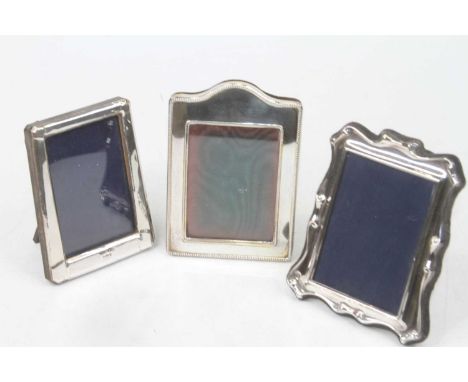 A modern silver easel photograph frame,London 1987, 8 x 6cm; together with two other similar  