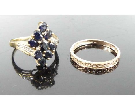 A modern 9ct gold and sapphire cluster ring, the shoulders each pavé set with three smaller white sapphires, size P; together