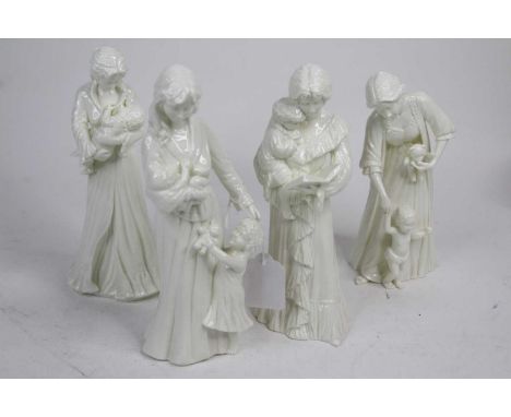 A collection of four Royal Worcester white glazed figures of mothers and children, the largest h.22cm 