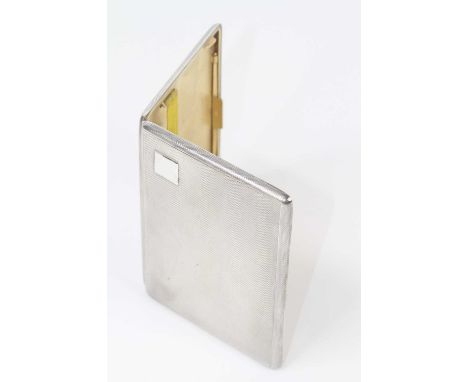 A George V silver cigarette case, of typical hinged rectangular form, having all-over engine turned decoration and vacant squ