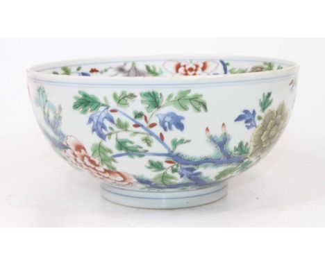 A Chinese porcelain bowl, enamel decorated with birds amongst flowers, dia.19cmSome fritting to the rim but otherwise intact.