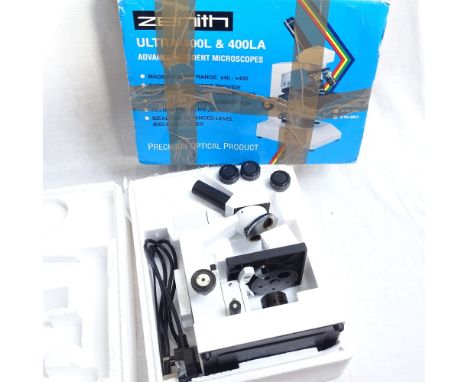 A boxed Zenith student's microscope 