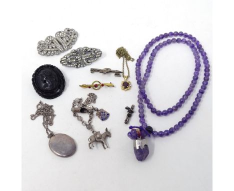 A Centurion carved jet brooch, a silver locket, an amethyst necklace etc 