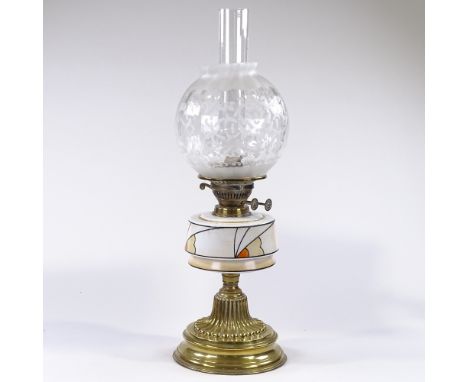 An Art Deco Duplex brass oil lamp, with stylised painted opaque glass font and etched glass shade, height to top of shade 49c