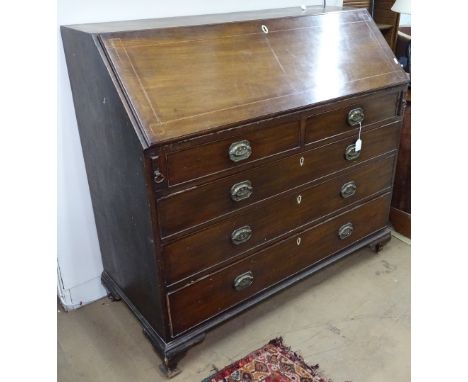 A large George III mahogany and satinwood-strung bureau, fall-front revealing a drawer and open shelf fitted interior, with 2