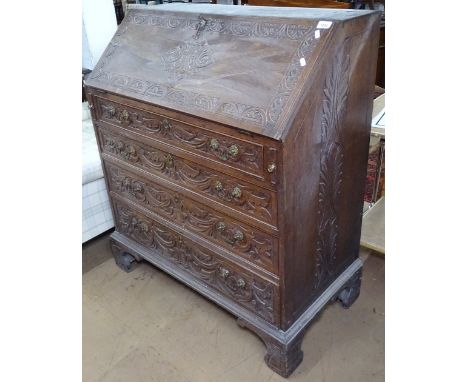 1920s carved oak bureau with 4 long drawers, on bracket feet, W92cm 