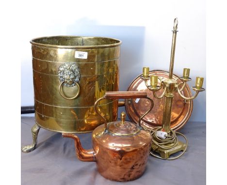 A brass coal bucket with lion mask ring handles, and paw feet, 39cm, a copper kettle, a bed-warming pan, and a table lamp 