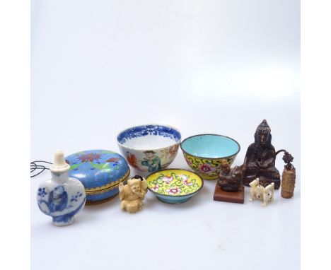 A mixed group of items, including a snuff bottle, a miniature bell, a netsuke, a porcelain cup etc 