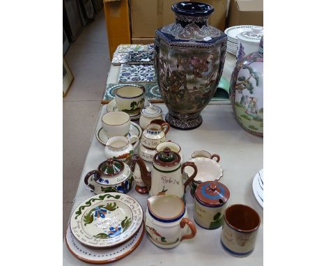 Poole Pottery dolphins, cat, and Torquay Moto Ware items