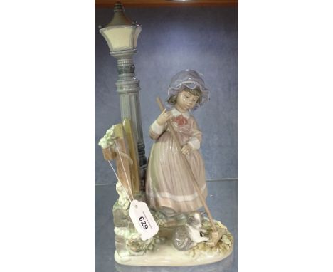 A Lladro figure, girl by a lamp post, 32.5cm 