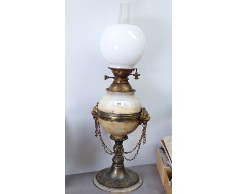 A brass-mounted alabaster oil lamp with chimney and shade, 76cm overall 
