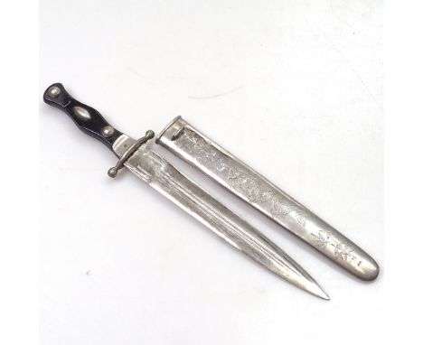 An Oriental dagger in engraved metal scabbard, 32.5cm 