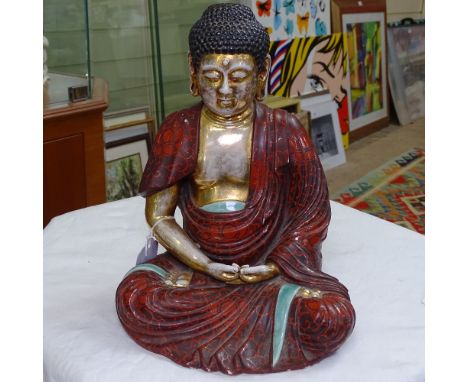 A Vintage painted and gilded ceramic Buddha, height 25cm 