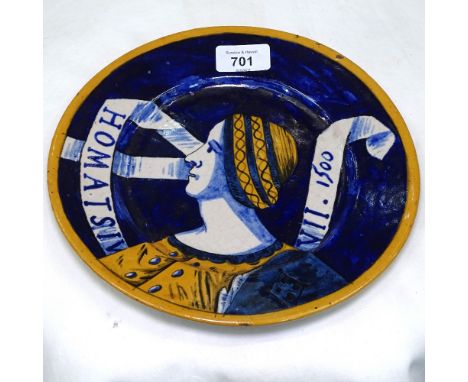 An Arts and Crafts plate with painted portrait, 23.5cm 