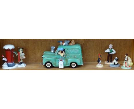 A shelf of Wallace &amp; Gromit figures, including a van, boxed 