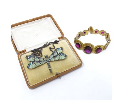 A red stone set and gilt-metal bracelet, and a green enamel dragonfly pendant and chain (2) 