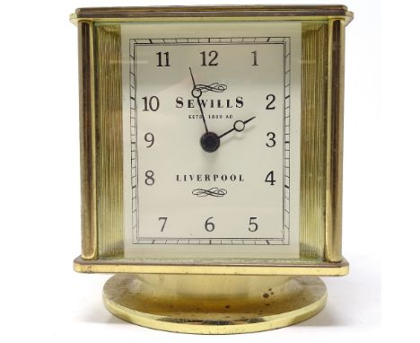 A Sewills of Liverpool revolving desk clock, thermometer, hydrometer and barometer, brass-cased with white faces, height 11cm