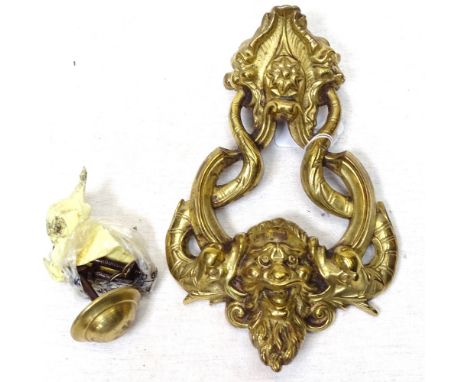 A cast-brass door knocker with mask decoration, height 23cm 
