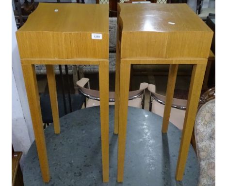 A pair of contemporary beech lamp tables, with shaped tops, raised on square legs, W34cm, H83cm 