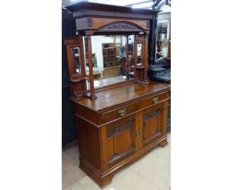 An Art Nouveau walnut mirror-back sideboard, base fitted with drawers and stylised panelled cupboards, on bracket feet, W137c