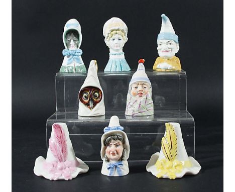 EIGHT ROYAL WORCESTER CANDLE EXTINGUISHERS, to include Old Woman, Mob Cap, Punch, Mr and Mrs Caudle, Owl and Tyrolean Hat (x2