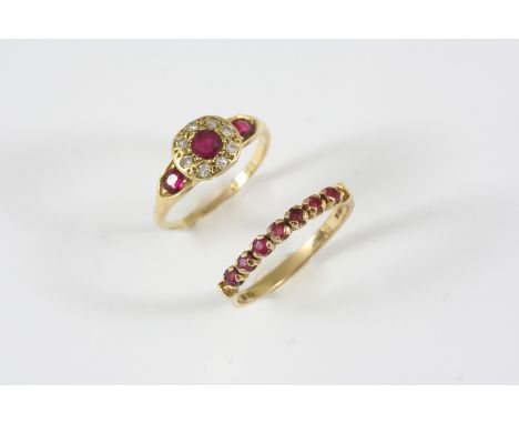 A RUBY AND DIAMOND CLUSTER RING the circular-cut ruby is set within a surround of single-cut diamonds, with an oval-shaped ru