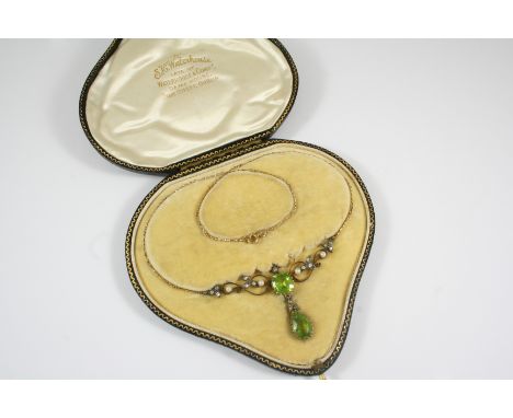 A VICTORIAN PERIDOT, DIAMOND AND PEARL NECKLACE centred with a cushion-shaped peridot within a gold openwork foliate mount se