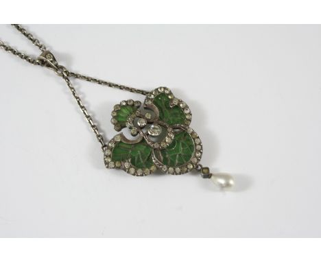 AN ART NOUVEAU ENAMEL PENDANT of foliate form, set with plique-a-jour green enamel and with white paste stones, in silver, 5c