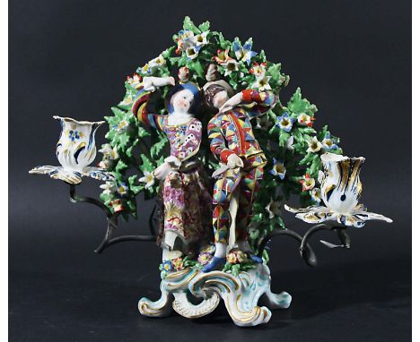 BOW BOCAGE CANDLESTICK GROUP, later 18th century, Harlequin and Columbine before flowering foliage on a scrolling base, with 